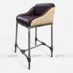 Water Pipe Iron-legged bar stool with a rexine leather seat in a modern design.