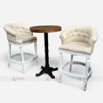 Modern bar furniture set with two white chairs and a round table, combining comfort and style.
