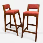 Two Wooden bar stool with red upholstered seat