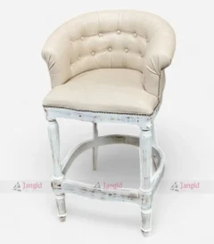 A luxurious white upholstery bar stool furniture with a buttoned back, perfect for high-end bars. Handmade with solid mango wood for a royal touch