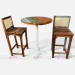 Reclaimed wood bar table and two chairs featuring cane work and circular table top.