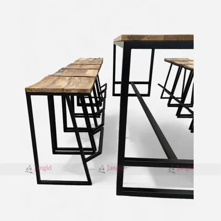 Wooden tables and stools made of rough mango wood tops and metal bases. Vintage, classic, and affordable bar furniture.