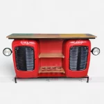 Front Angle of Restored red truck bar cabinet with wooden shelf, functional side head lights. Vintage auto bar furniture.