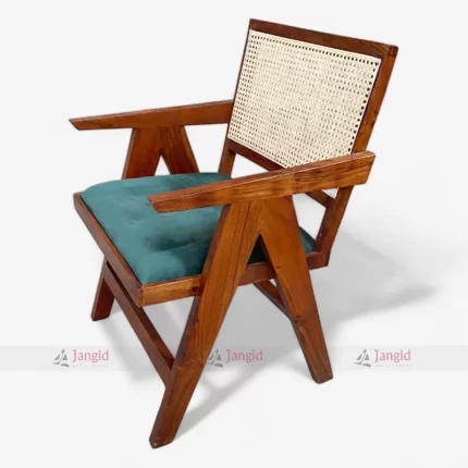 A mid century Chandigarh wooden chair with a velvet seat & cane back, designed for comfort and style, suitable for cafes, restaurant, hotels, and home dining areas.