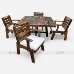 Wooden dining table with four chairs set, perfect for outdoor swimming poolside gatherings.