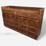 A beautifully carved wooden service station, enhancing the decor of a cafe restaurant.