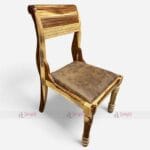 A wooden chair featuring a brown upholstered foam seat, designed for dining in cafes and restaurants, made from Sheesham wood.