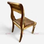 A wooden chair featuring a brown upholstered foam seat, designed for dining in cafes and restaurants, made from Sheesham wood.